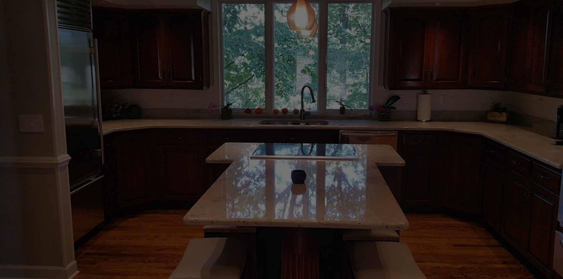 Cherry kitchen cabinets with white countertops